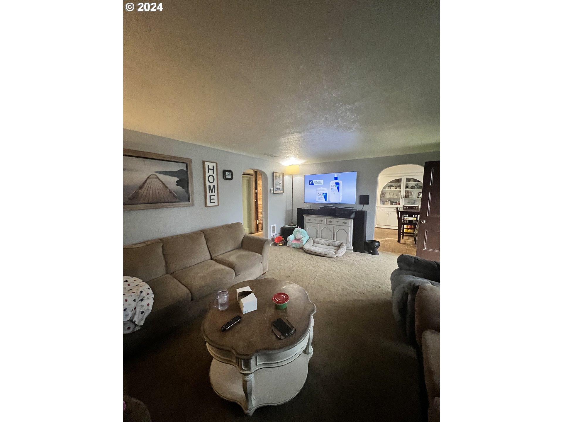 271 22nd Street Springfield, OR 97477 - Photo 4 of 28 a living room with furniture and a flat screen tv