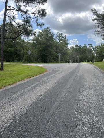 a view of a house with a big yard