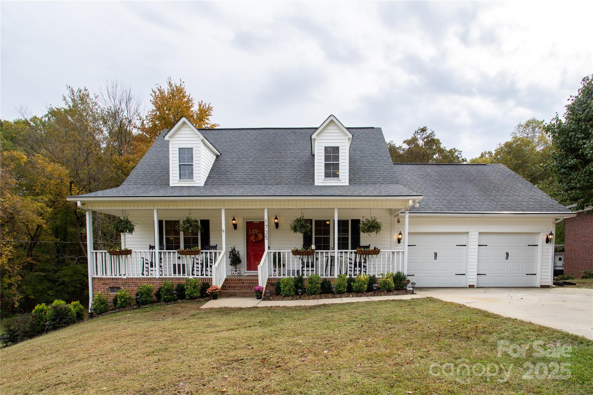 1735 Kallaramo Road Rock Hill, SC 29732 - Photo 2 of 30 a view of a white house with large windows and a small yard