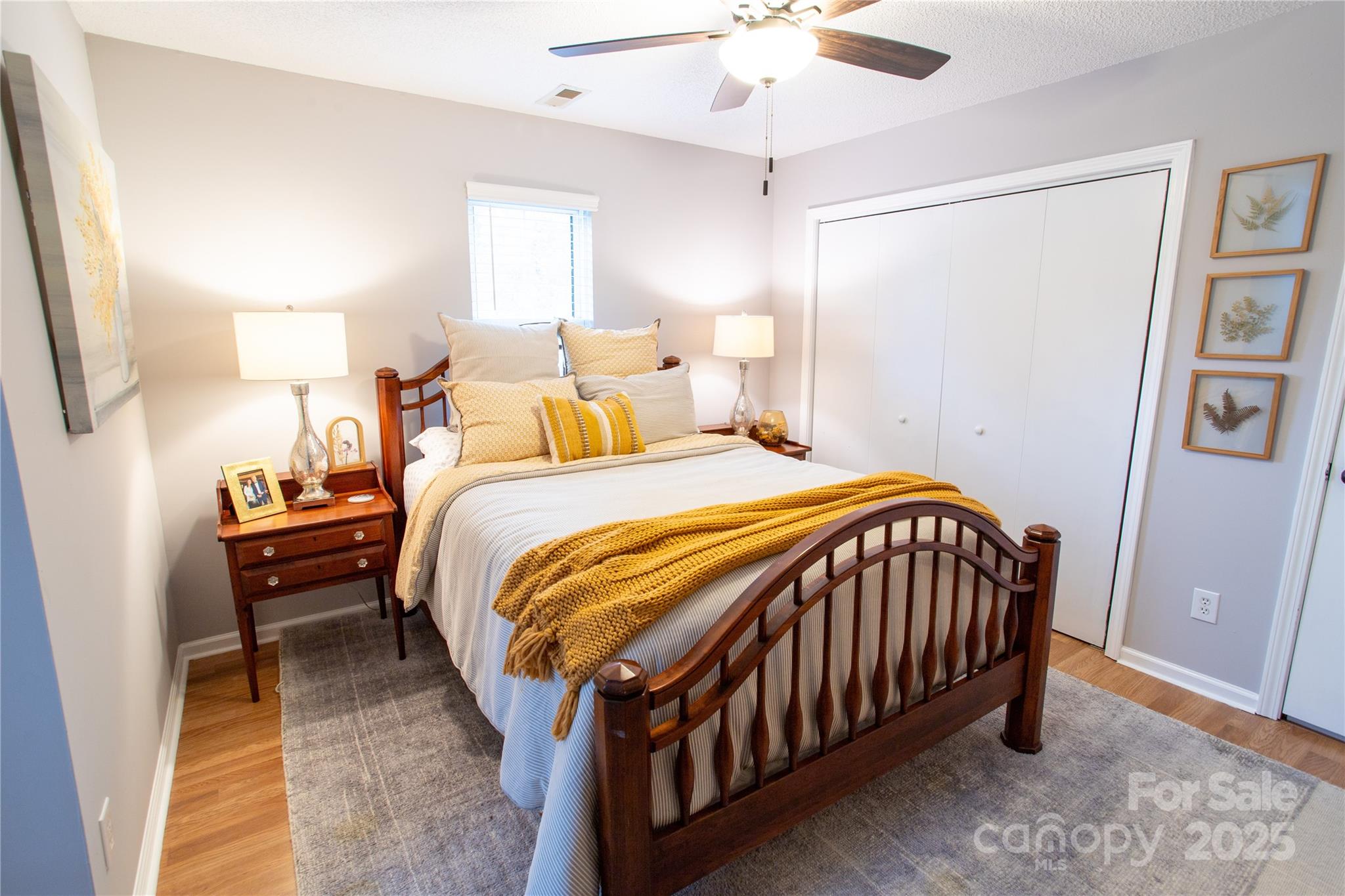 1735 Kallaramo Road Rock Hill, SC 29732 - Photo 26 of 30 a bedroom with a bed and a chandelier