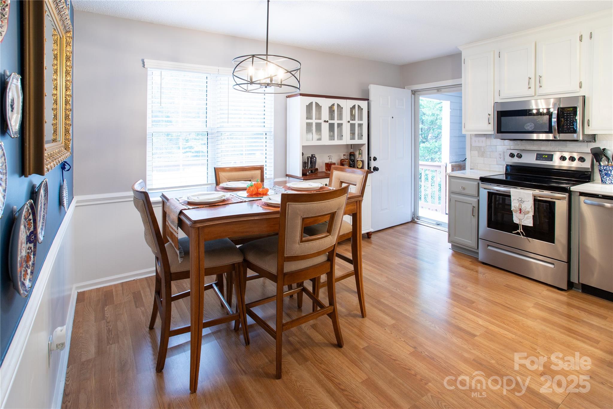 1735 Kallaramo Road Rock Hill, SC 29732 - Photo 8 of 30 a view of a dining room with furniture window and wooden floor