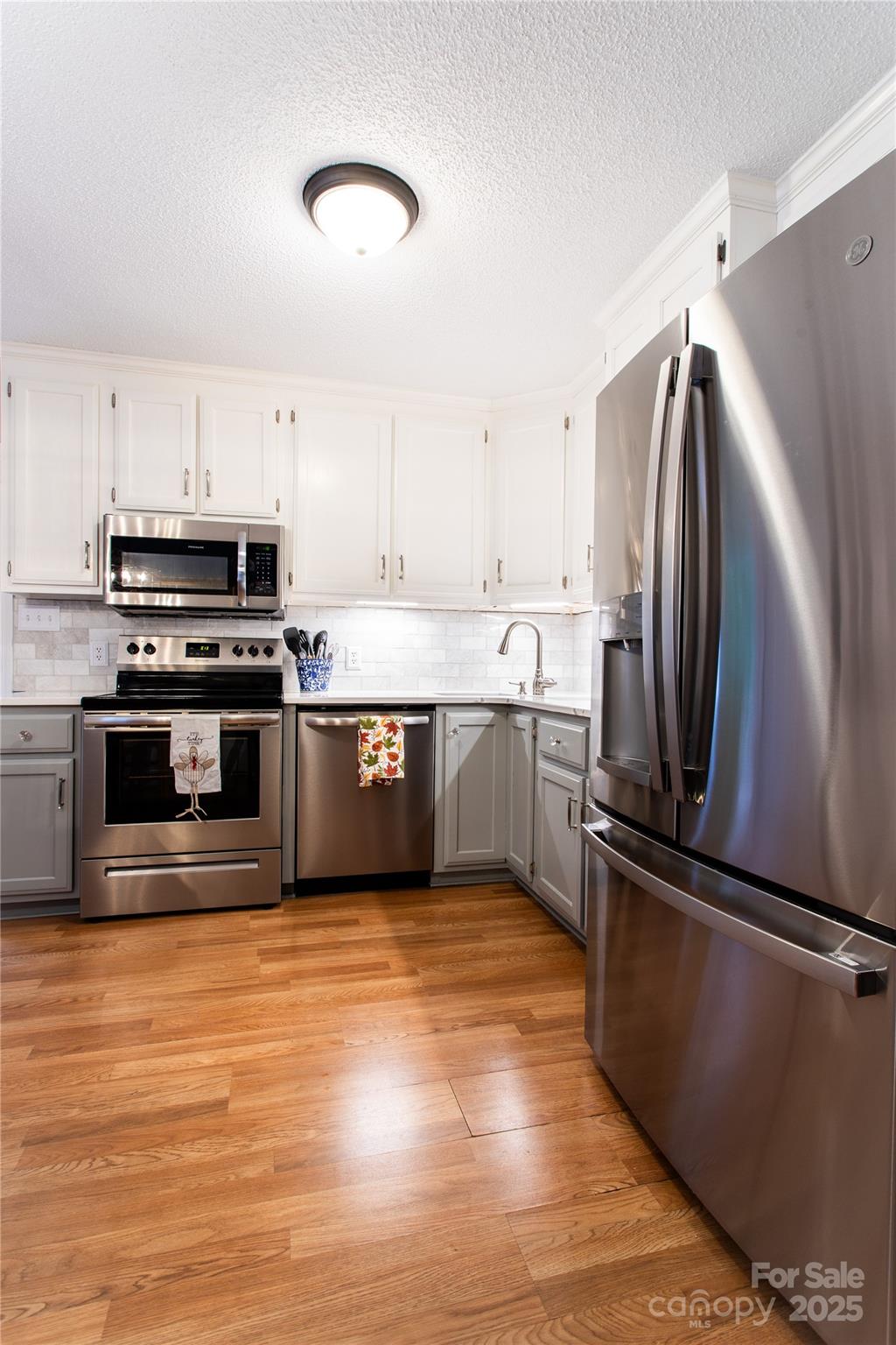 1735 Kallaramo Road Rock Hill, SC 29732 - Photo 10 of 30 a kitchen with stainless steel appliances a stove a sink and a refrigerator