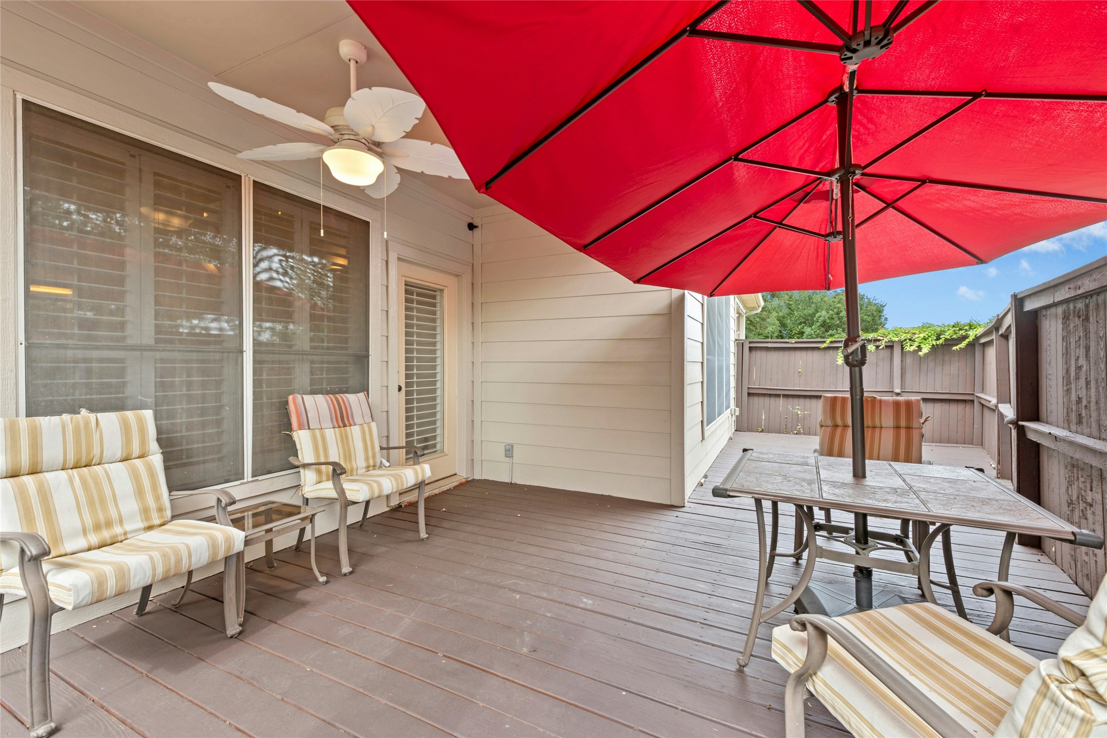 7500 Shadowridge Run, Unit 34 Austin, TX 78749 - Photo 26 of 27 an outdoor space with furniture and umbrella