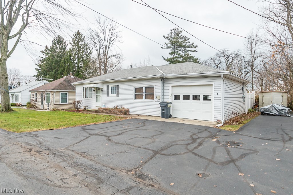 5 Pleasantview Vermilion, OH 44089 - Photo 2 of 37 Ranch-style home with a front lawn and a garage