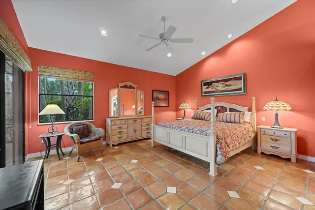 a bed room with a bed and a chair