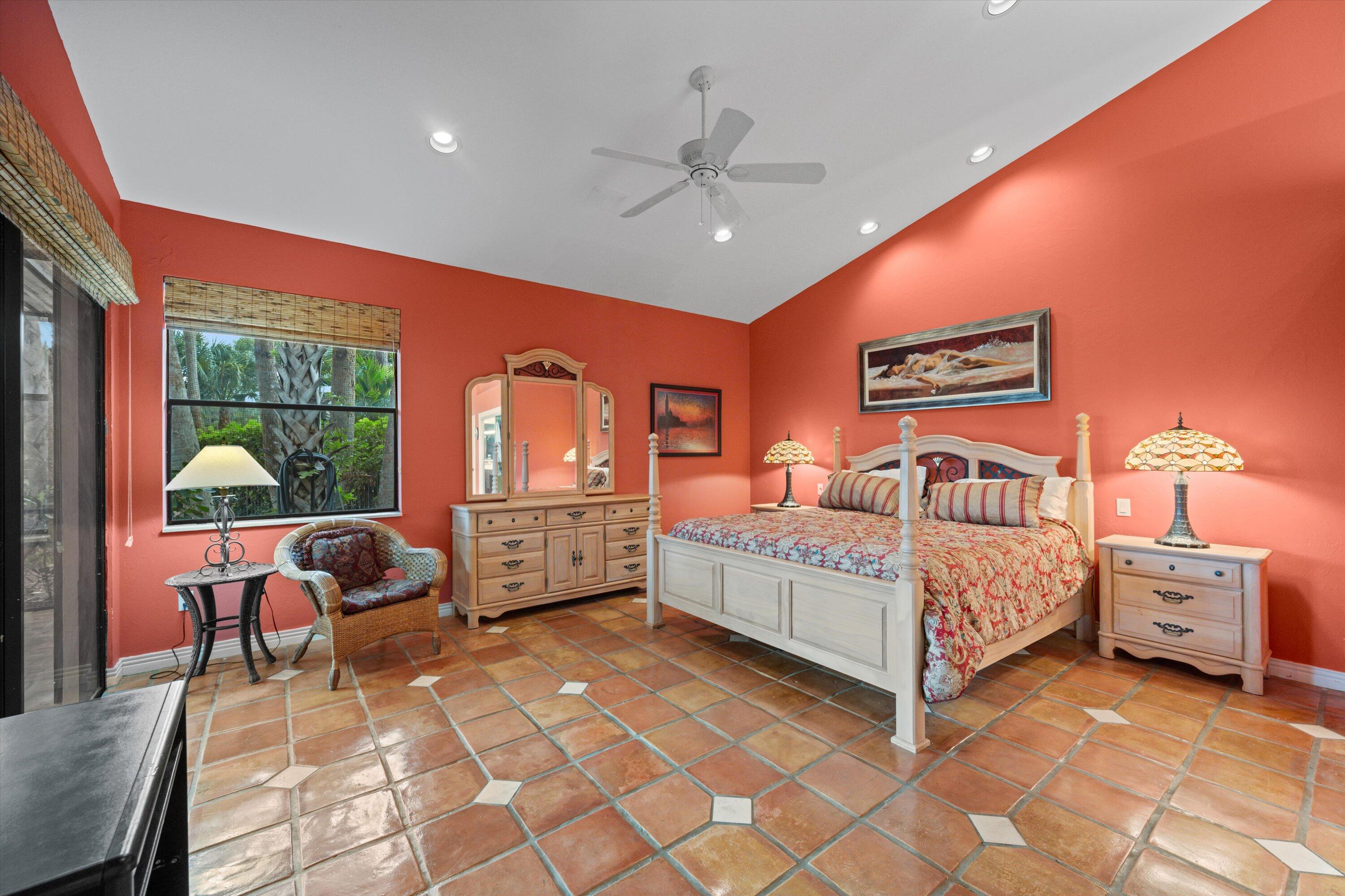 1535 Fairway Terrace West Palm Beach, FL 33411 - Photo 14 of 47 a bed room with a bed and a chair