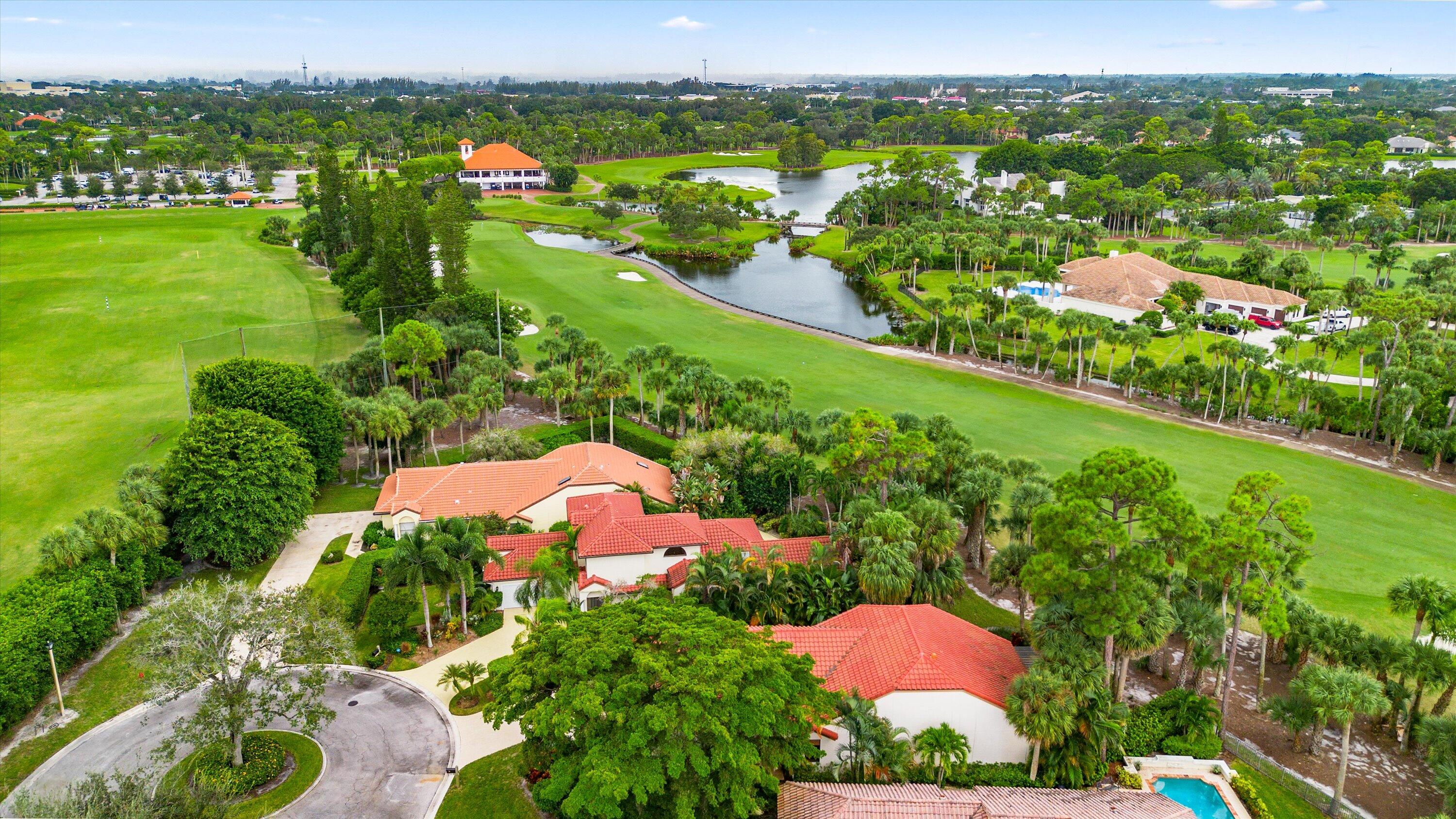 1535 Fairway Terrace West Palm Beach, FL 33411 - Photo 25 of 47 an aerial view of a houses with a yard and lake view