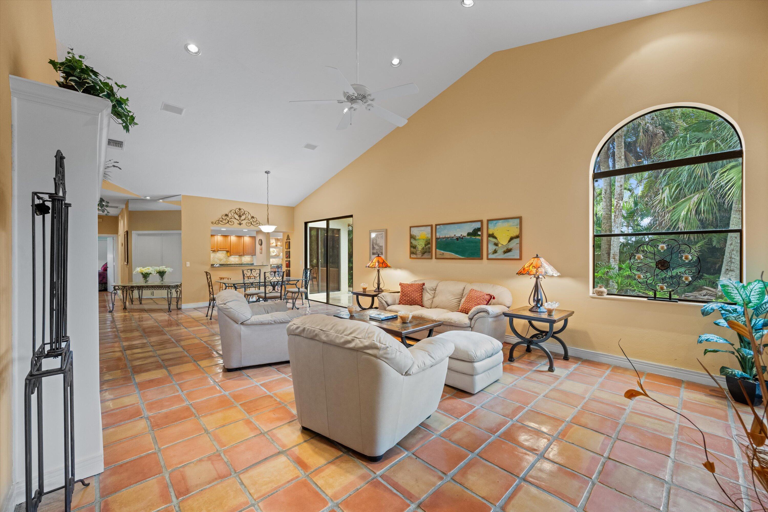 1535 Fairway Terrace West Palm Beach, FL 33411 - Photo 4 of 47 a living room with fireplace furniture and a large window