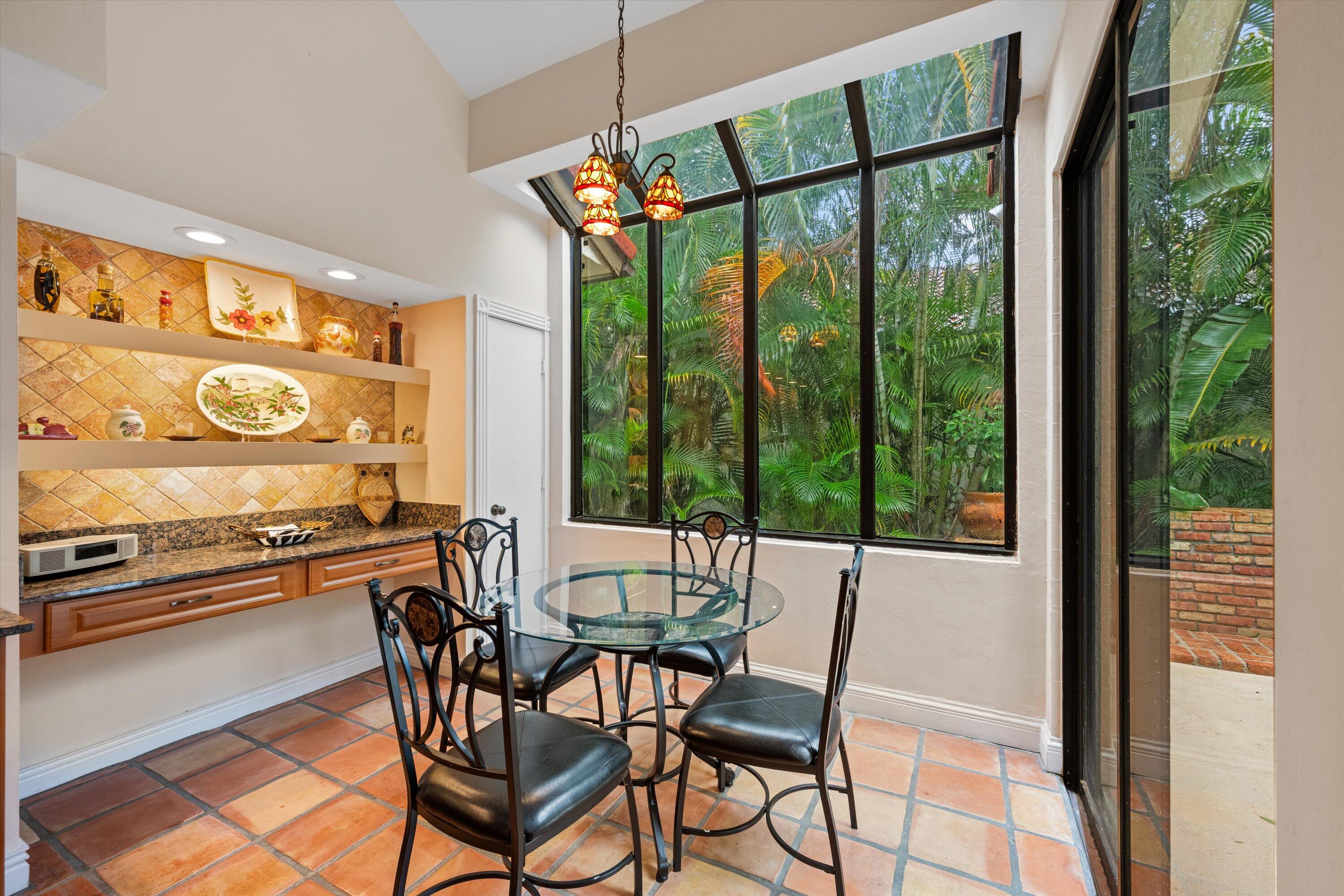 1535 Fairway Terrace West Palm Beach, FL 33411 - Photo 10 of 47 a view of a dining room with furniture window and outside view