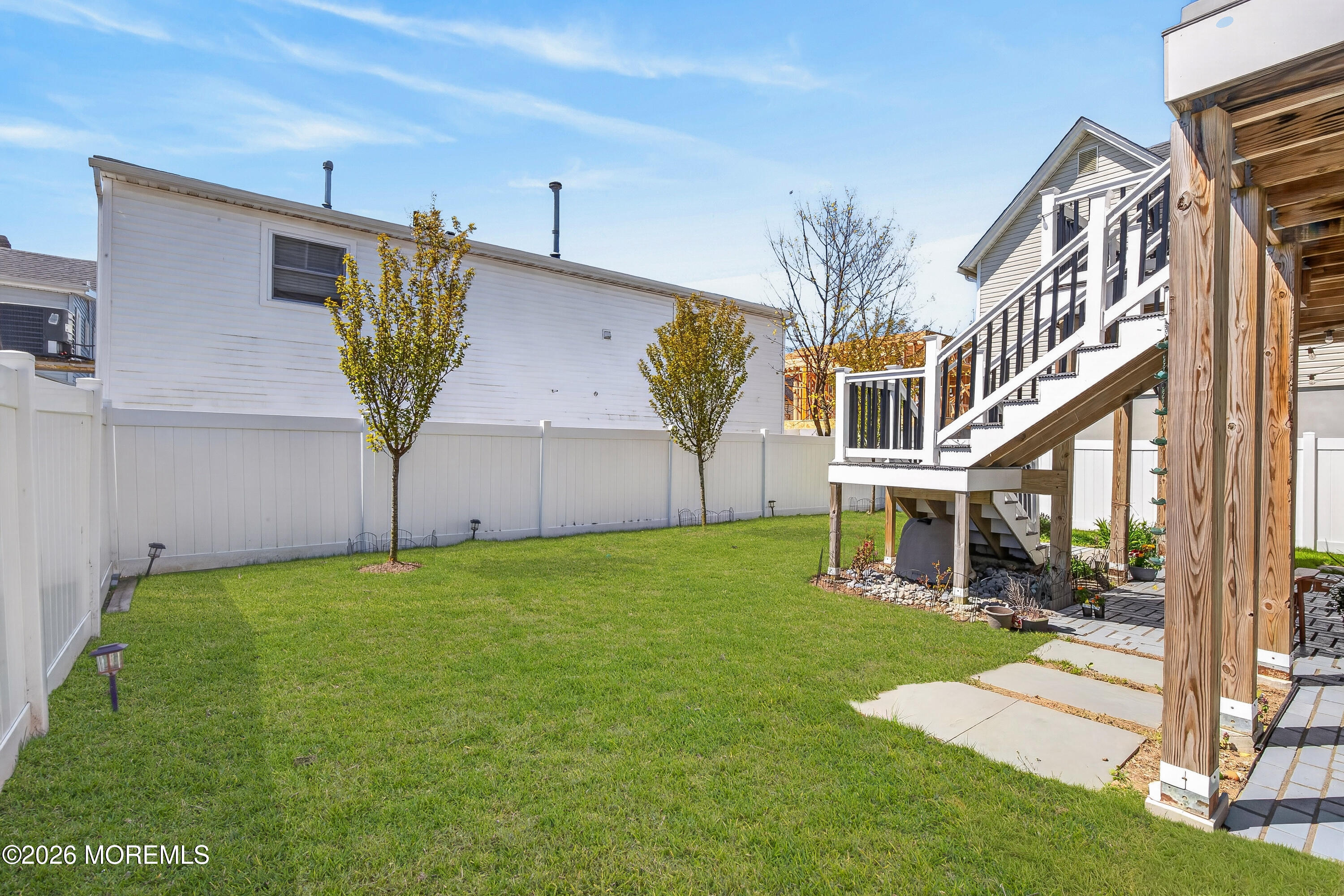 27 5th Street Highlands, NJ 07732 - Photo 62 of 62 a view of an house with backyard and a tree