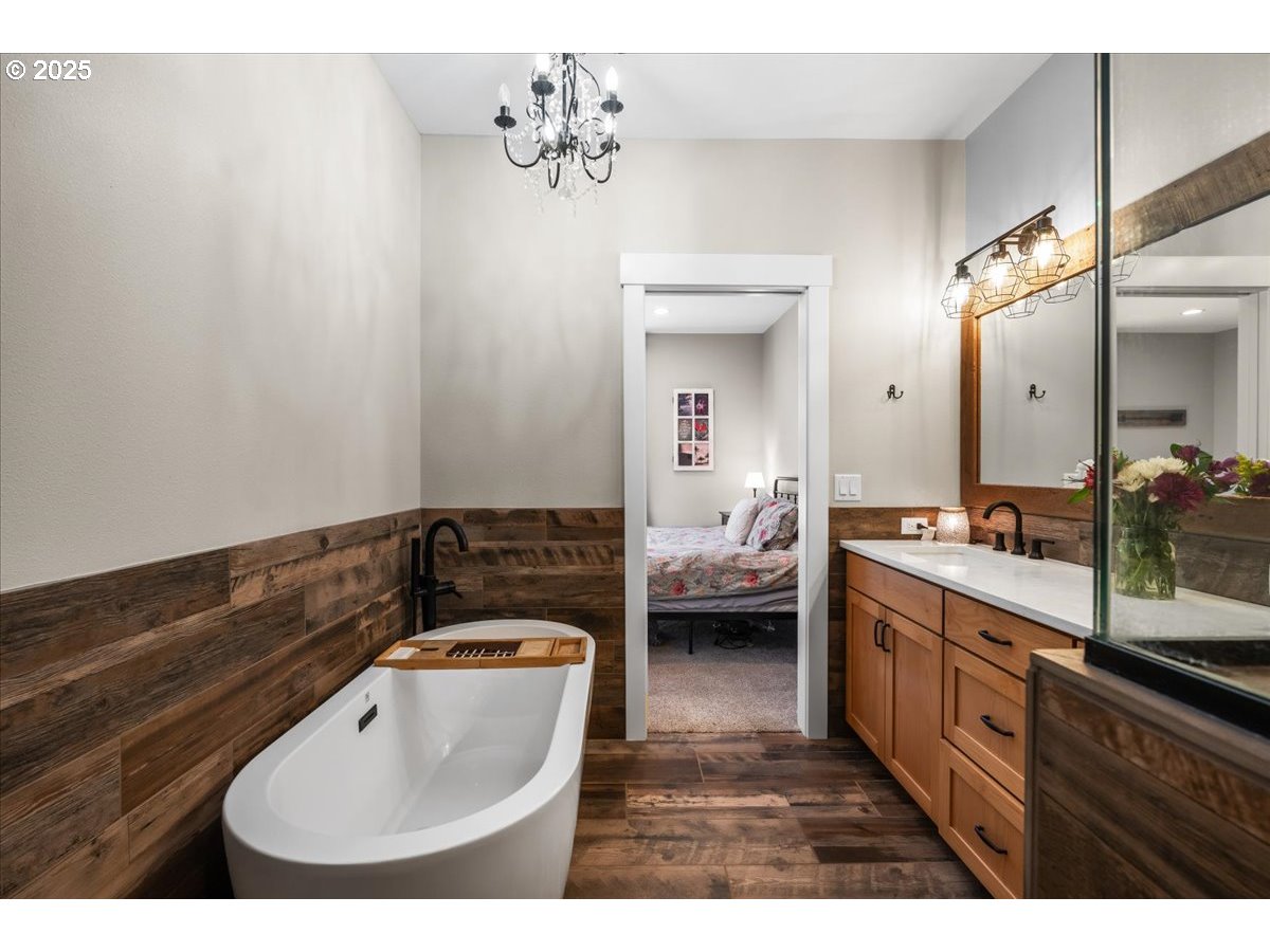 43300 Northwest Cedar Canyon Road Banks, OR 97106 - Photo 15 of 48 a en suite bathroom with a sink and a mirror