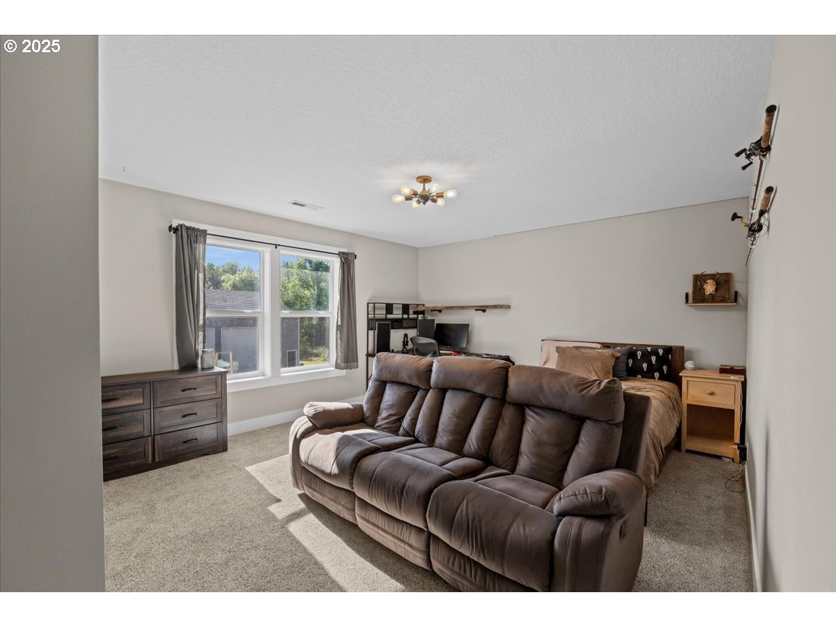 43300 Northwest Cedar Canyon Road Banks, OR 97106 - Photo 18 of 48 a living room with furniture and a window