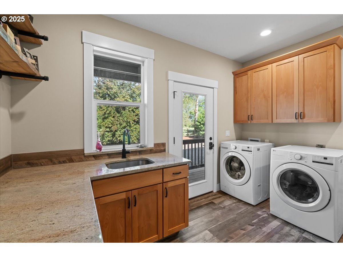 43300 Northwest Cedar Canyon Road Banks, OR 97106 - Photo 23 of 48 a utility room with sink dryer and washer