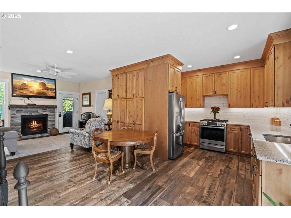 43300 Northwest Cedar Canyon Road Banks, OR 97106 - Photo 25 of 48 a living room with furniture wooden floor and a fireplace