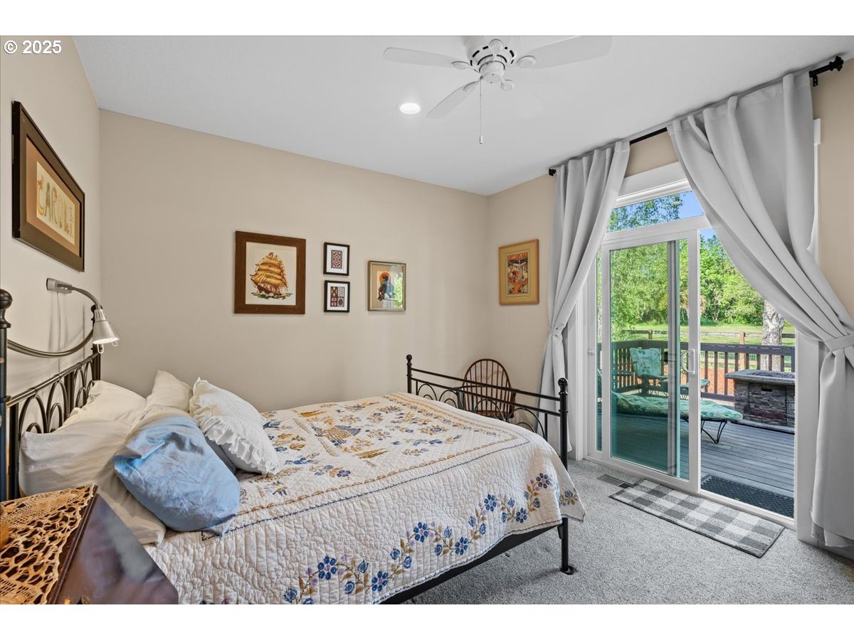 43300 Northwest Cedar Canyon Road Banks, OR 97106 - Photo 29 of 48 a bedroom with a bed and a window