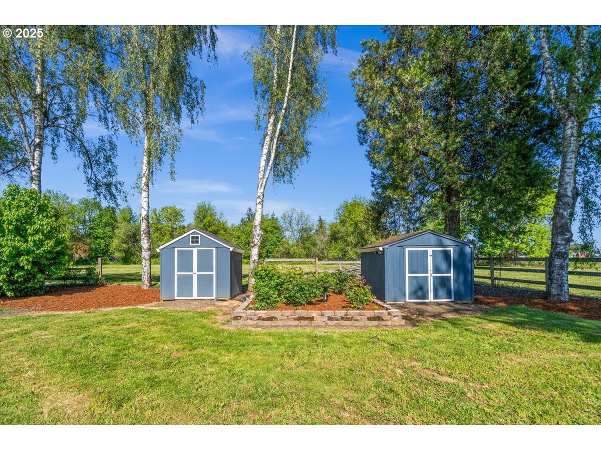 43300 Northwest Cedar Canyon Road Banks, OR 97106 - Photo 33 of 48 a view of a house with backyard porch and garden