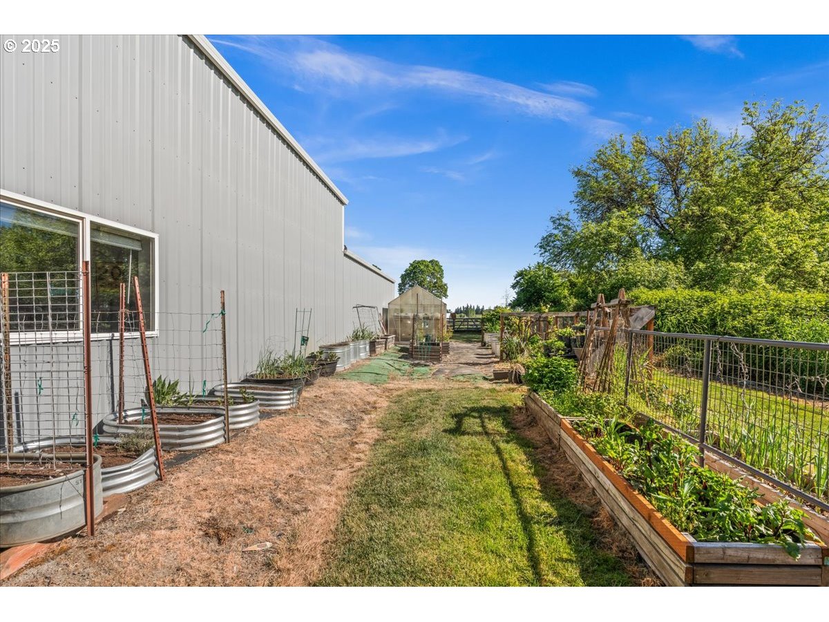 43300 Northwest Cedar Canyon Road Banks, OR 97106 - Photo 38 of 48 a backyard of a house with table and chairs