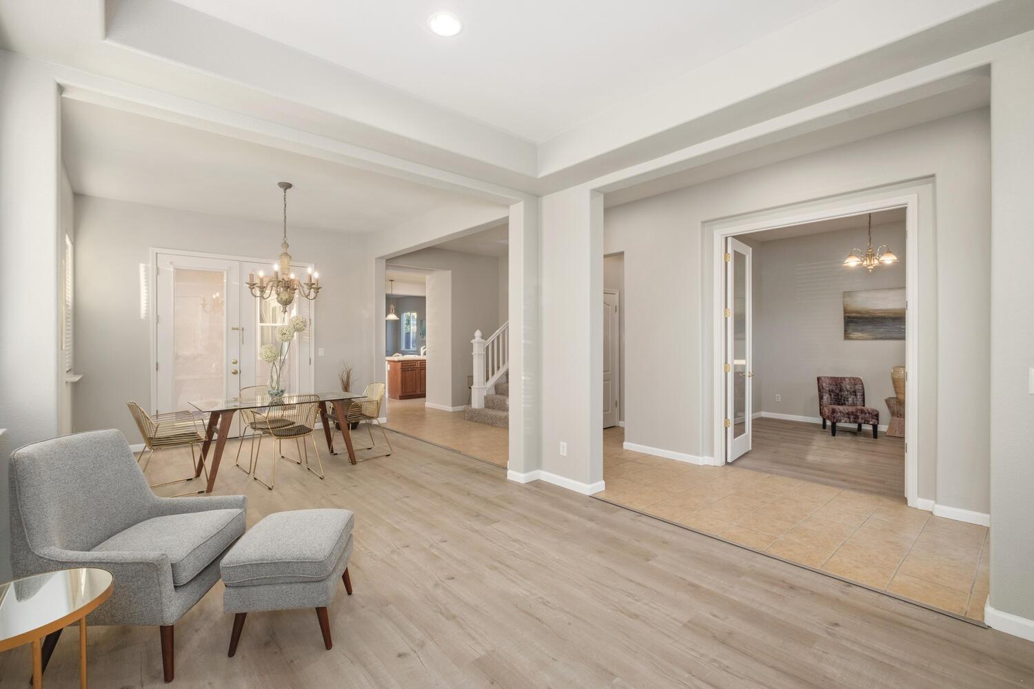 3331 Serena Avenue Clovis, CA 93619 - Photo 11 of 41 a living room with furniture and a dining table