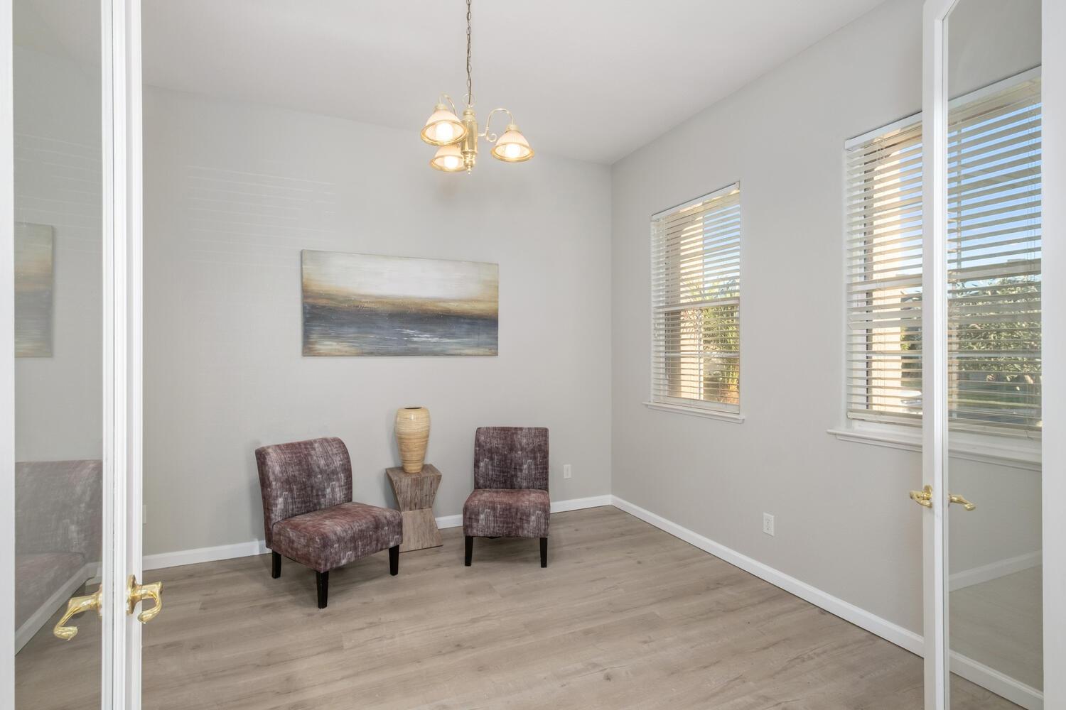 3331 Serena Avenue Clovis, CA 93619 - Photo 14 of 41 a living room with furniture and a chandelier
