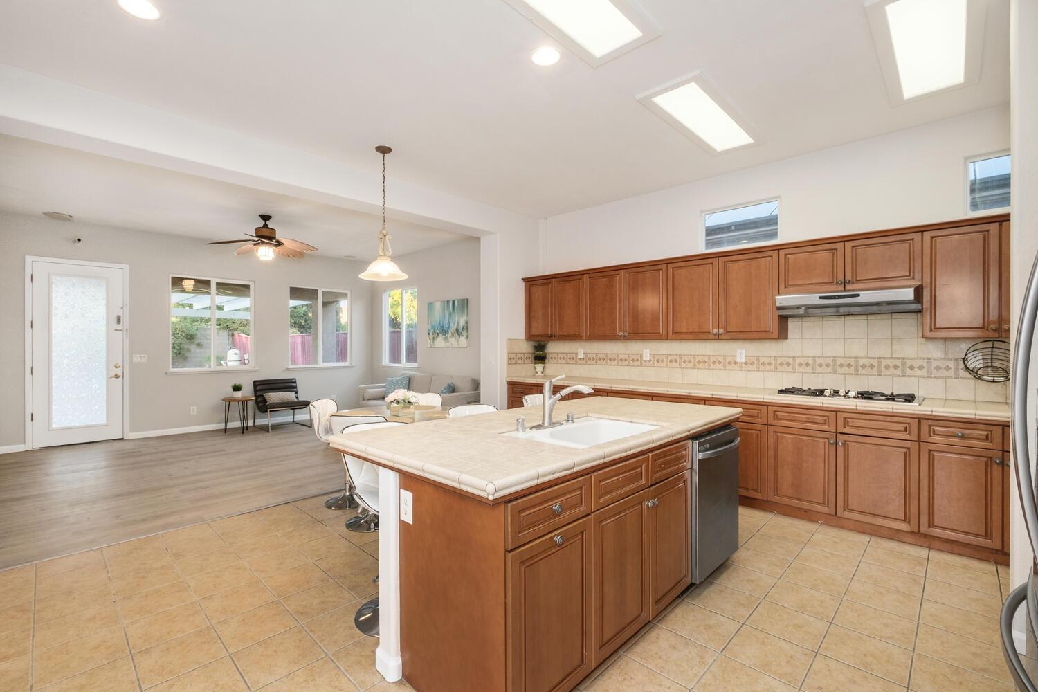 3331 Serena Avenue Clovis, CA 93619 - Photo 15 of 41 a kitchen with a sink stove and cabinets