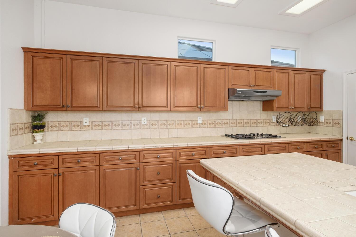3331 Serena Avenue Clovis, CA 93619 - Photo 16 of 41 a kitchen with cabinets a sink and appliances
