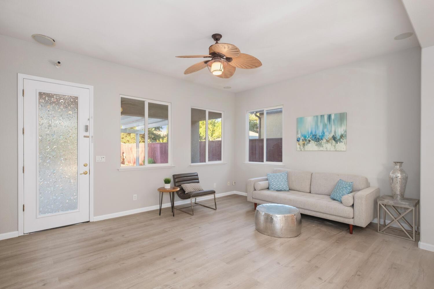3331 Serena Avenue Clovis, CA 93619 - Photo 20 of 41 a living room with furniture and a chandelier