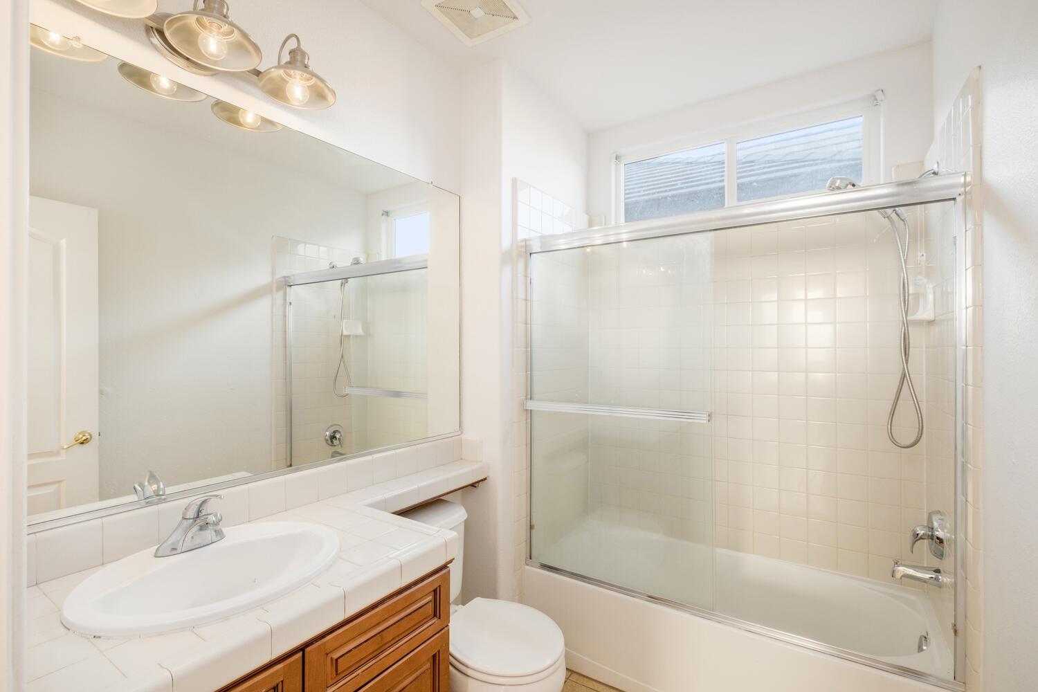 3331 Serena Avenue Clovis, CA 93619 - Photo 23 of 41 a bathroom with a sink toilet and shower