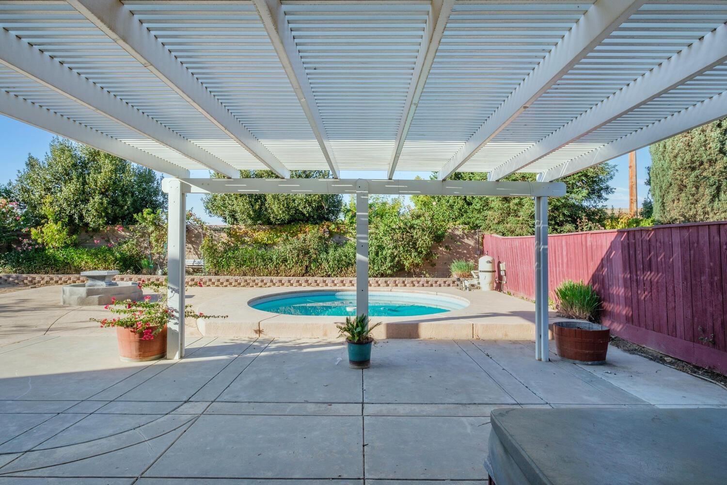 3331 Serena Avenue Clovis, CA 93619 - Photo 37 of 41 a view of a swimming pool with a patio