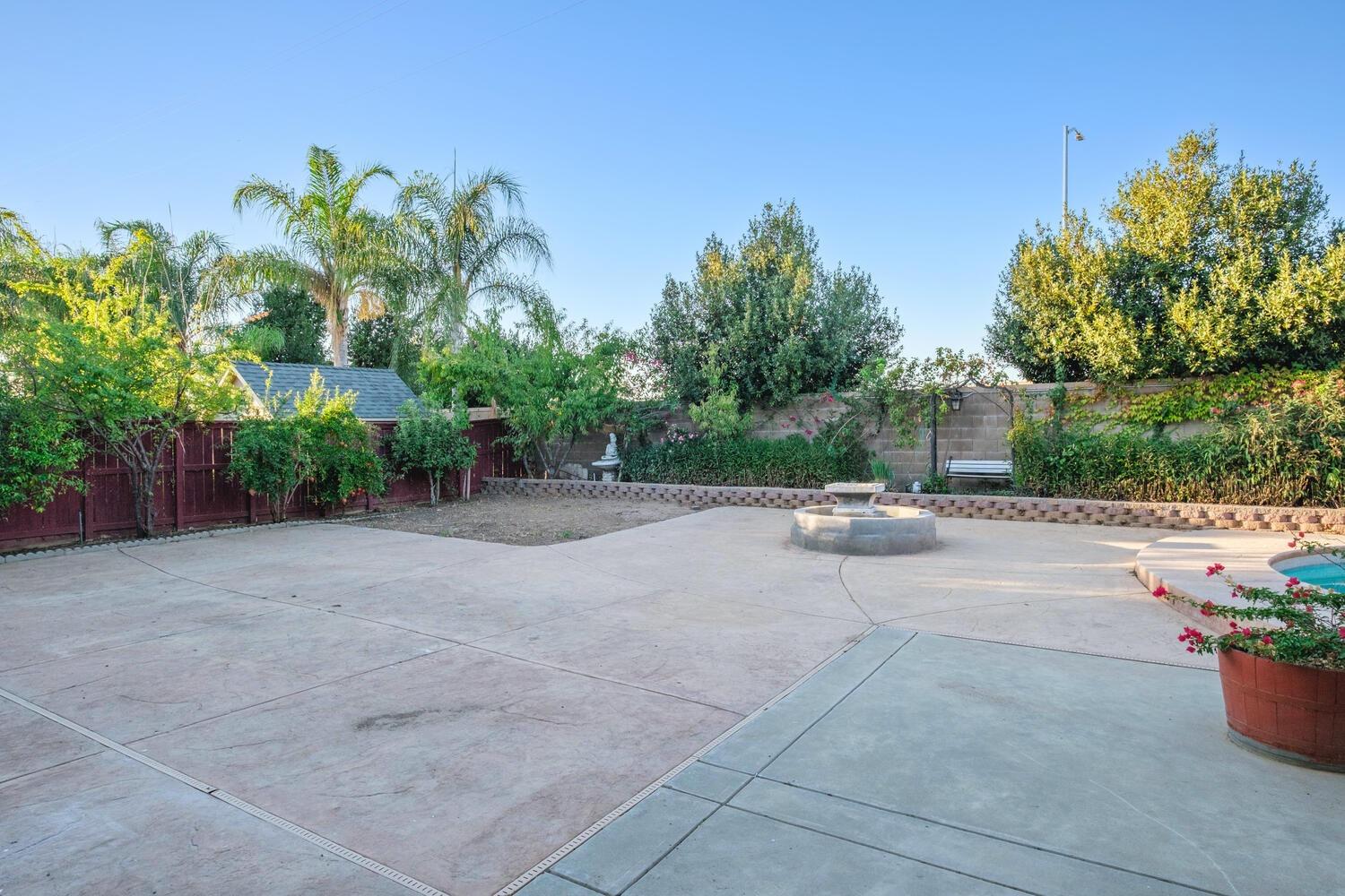3331 Serena Avenue Clovis, CA 93619 - Photo 38 of 41 a view of a street with a bench and some trees