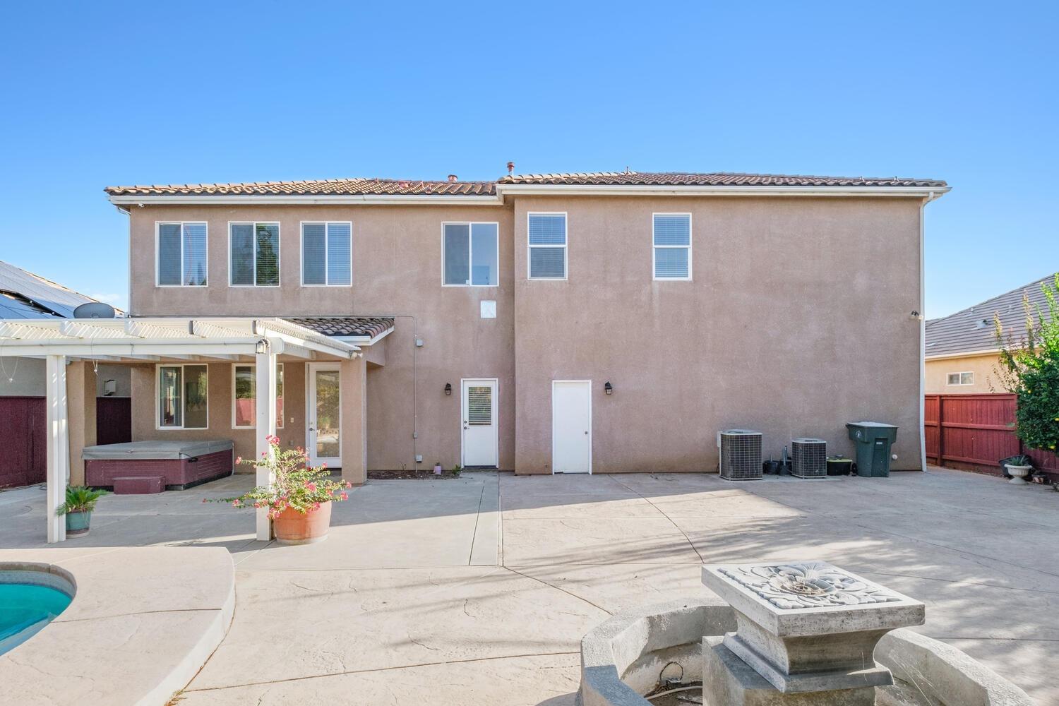 3331 Serena Avenue Clovis, CA 93619 - Photo 39 of 41 a backyard of a house with barbeque oven and outdoor seating
