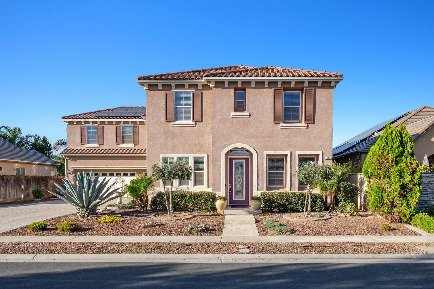 3331 Serena Avenue Clovis, CA 93619 - Photo 40 of 41 a front view of a house with a yard