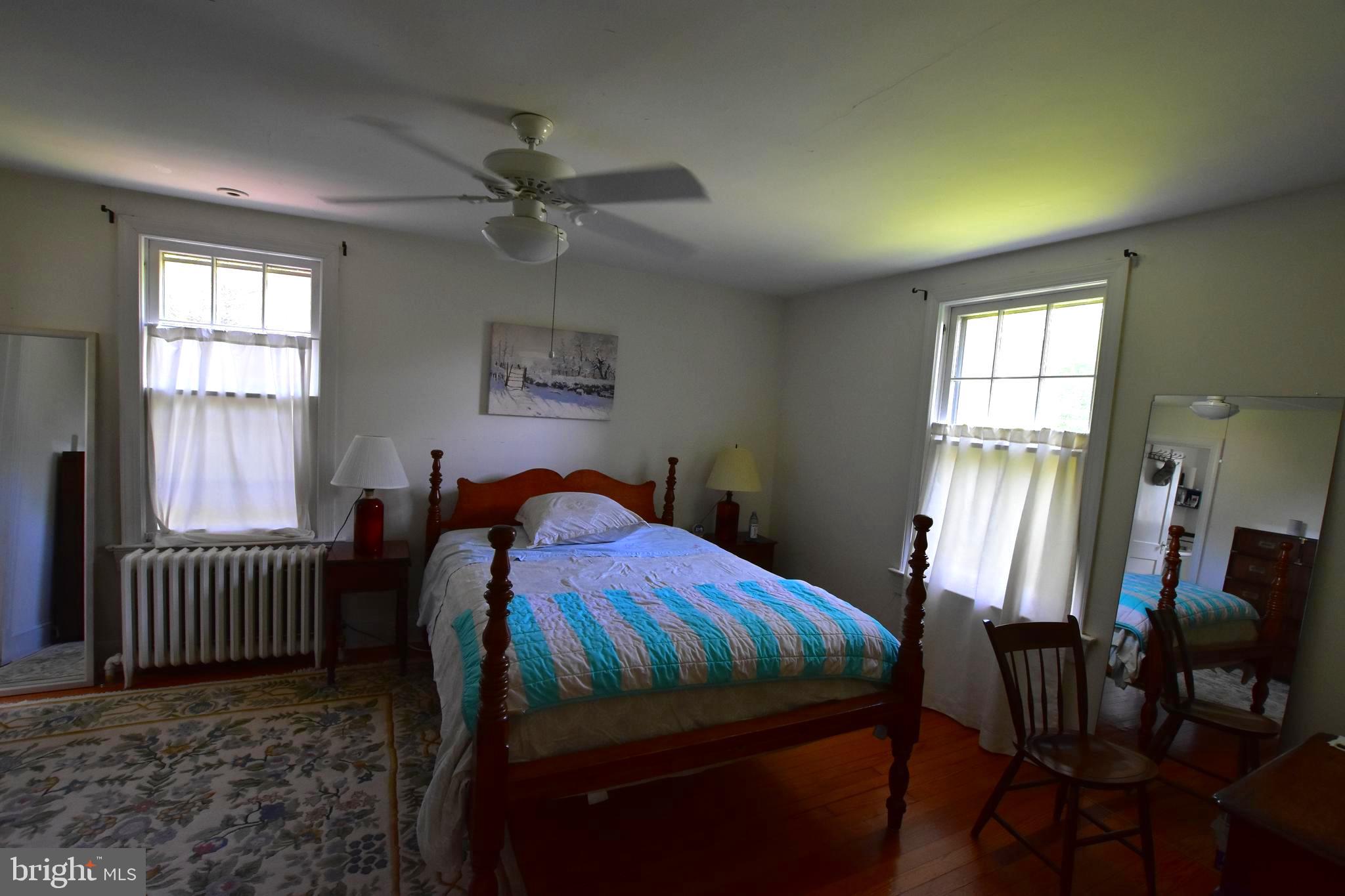 1300 Noyes Drive Silver Spring, MD 20910 - Photo 14 of 30 a bedroom with a bed and windows