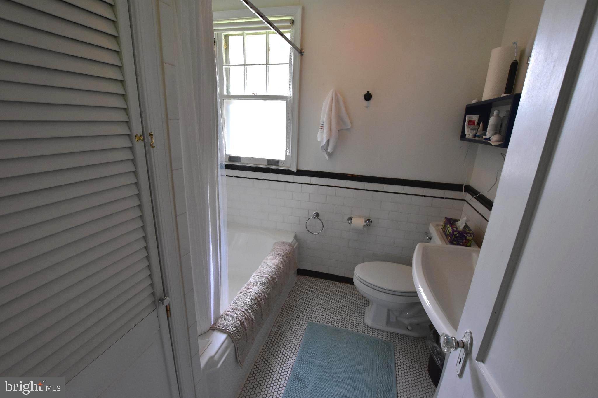 1300 Noyes Drive Silver Spring, MD 20910 - Photo 15 of 30 a bathroom with a toilet and a shower