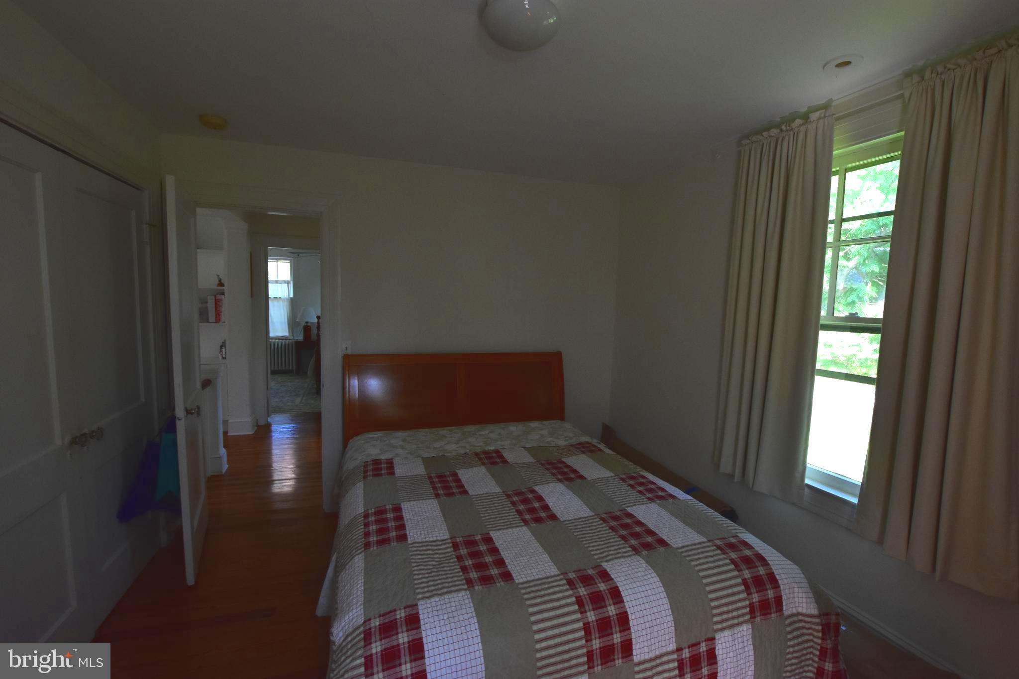 1300 Noyes Drive Silver Spring, MD 20910 - Photo 17 of 30 a bedroom with a bed and a window