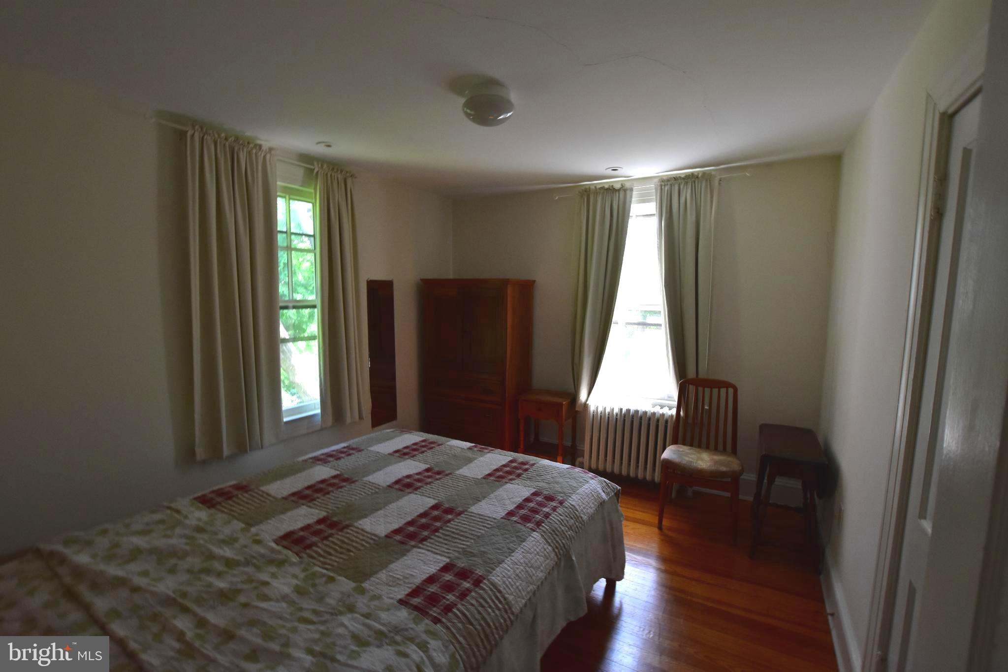 1300 Noyes Drive Silver Spring, MD 20910 - Photo 18 of 30 a bedroom with a bed and a window