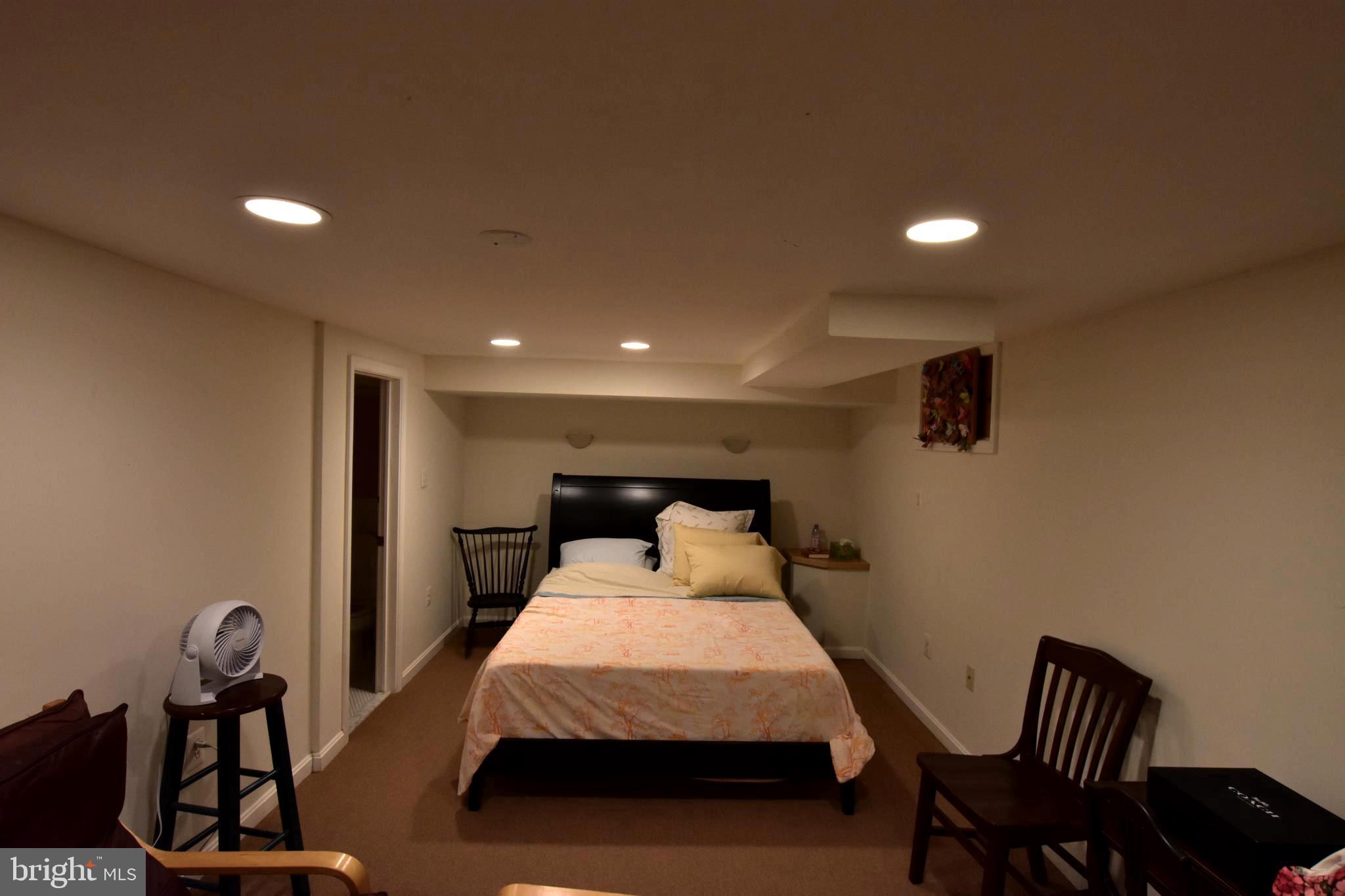 1300 Noyes Drive Silver Spring, MD 20910 - Photo 20 of 30 a bed room with a bed and chair