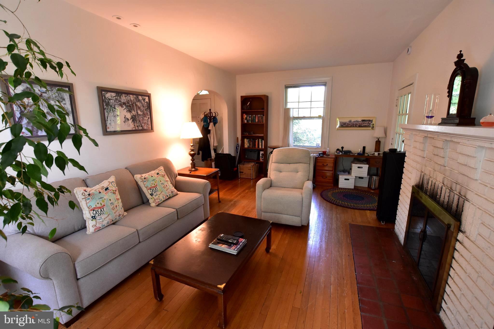 1300 Noyes Drive Silver Spring, MD 20910 - Photo 2 of 30 a living room with furniture and a fireplace