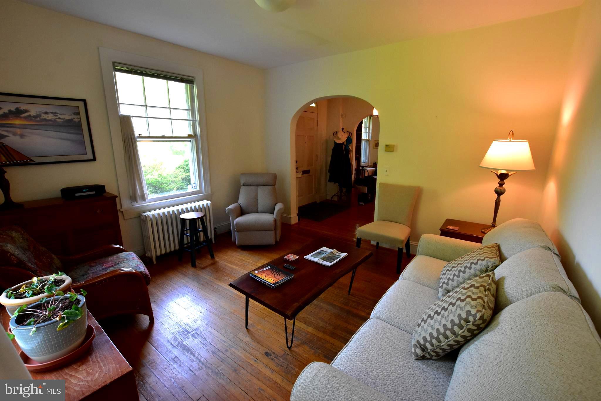1300 Noyes Drive Silver Spring, MD 20910 - Photo 5 of 30 a living room with furniture rug and window