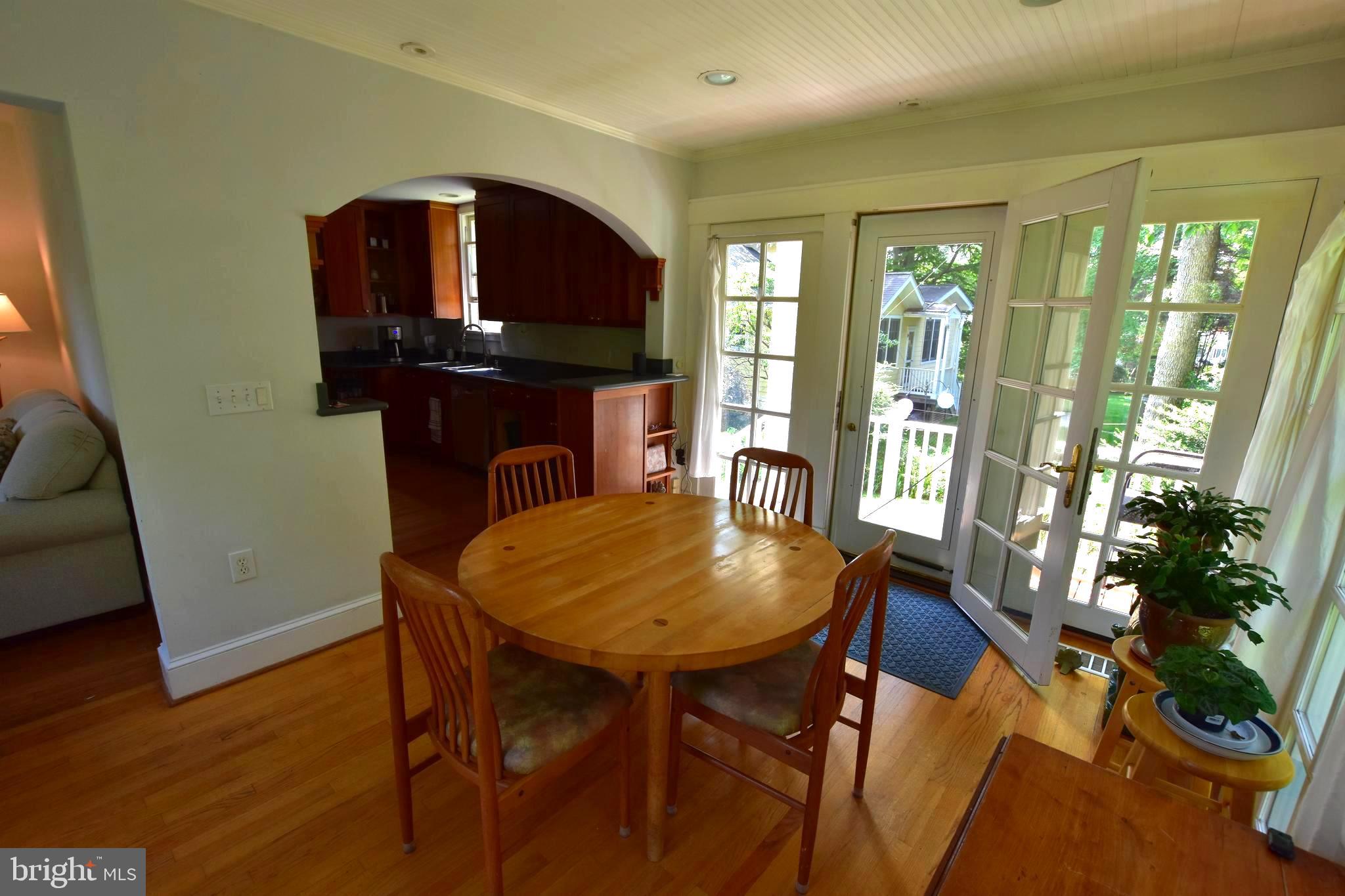 1300 Noyes Drive Silver Spring, MD 20910 - Photo 7 of 30 a view of a dining room with furniture window and wooden floor