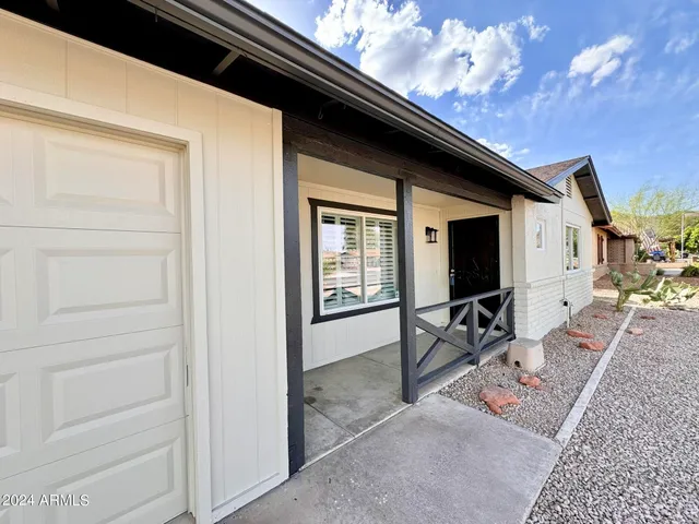 a backyard of a house with seating space