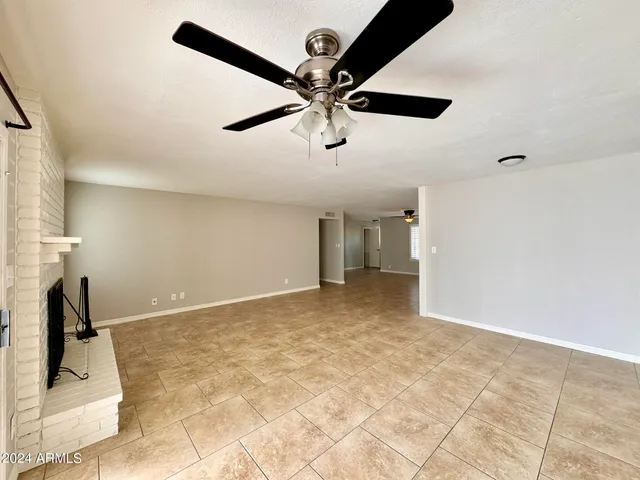 a view of a kitchen with a sink and cabinets