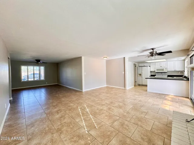 a large kitchen with cabinets and stainless steel appliances