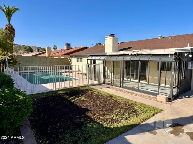 a view of a house with a garden
