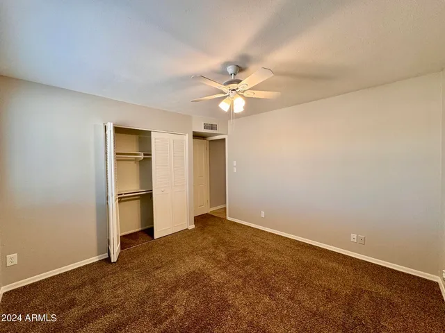 a bathroom with a toilet sink and shower