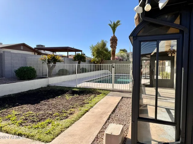 a view of a house with a wooden deck