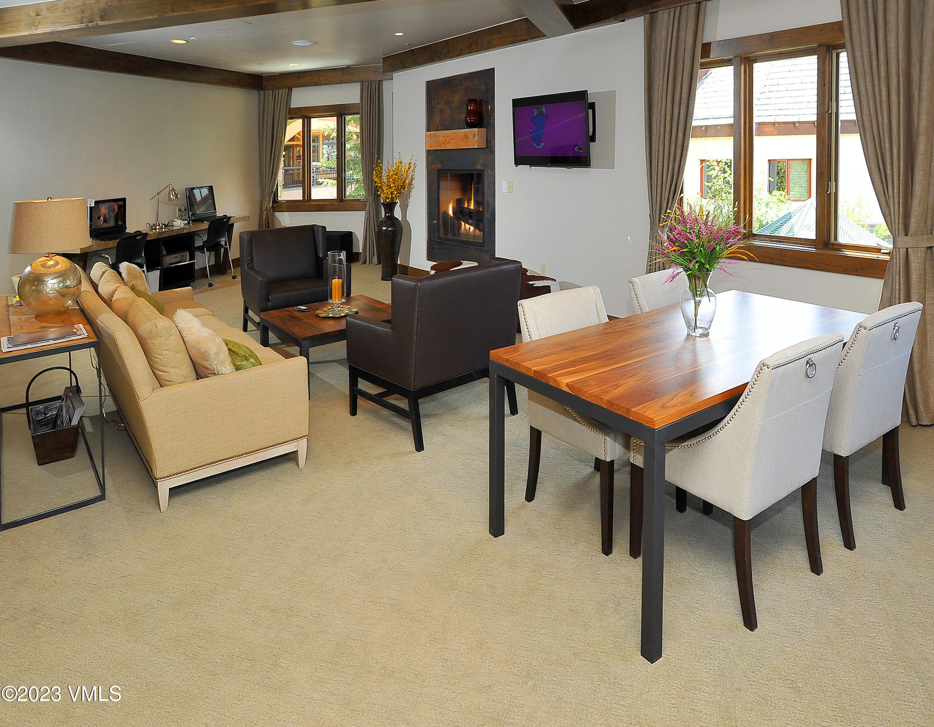 210 Offerson Road, Unit 109WEEK 11 Beaver Creek, CO 81620 - Photo 21 of 25 a living room with furniture a flat screen tv and a window