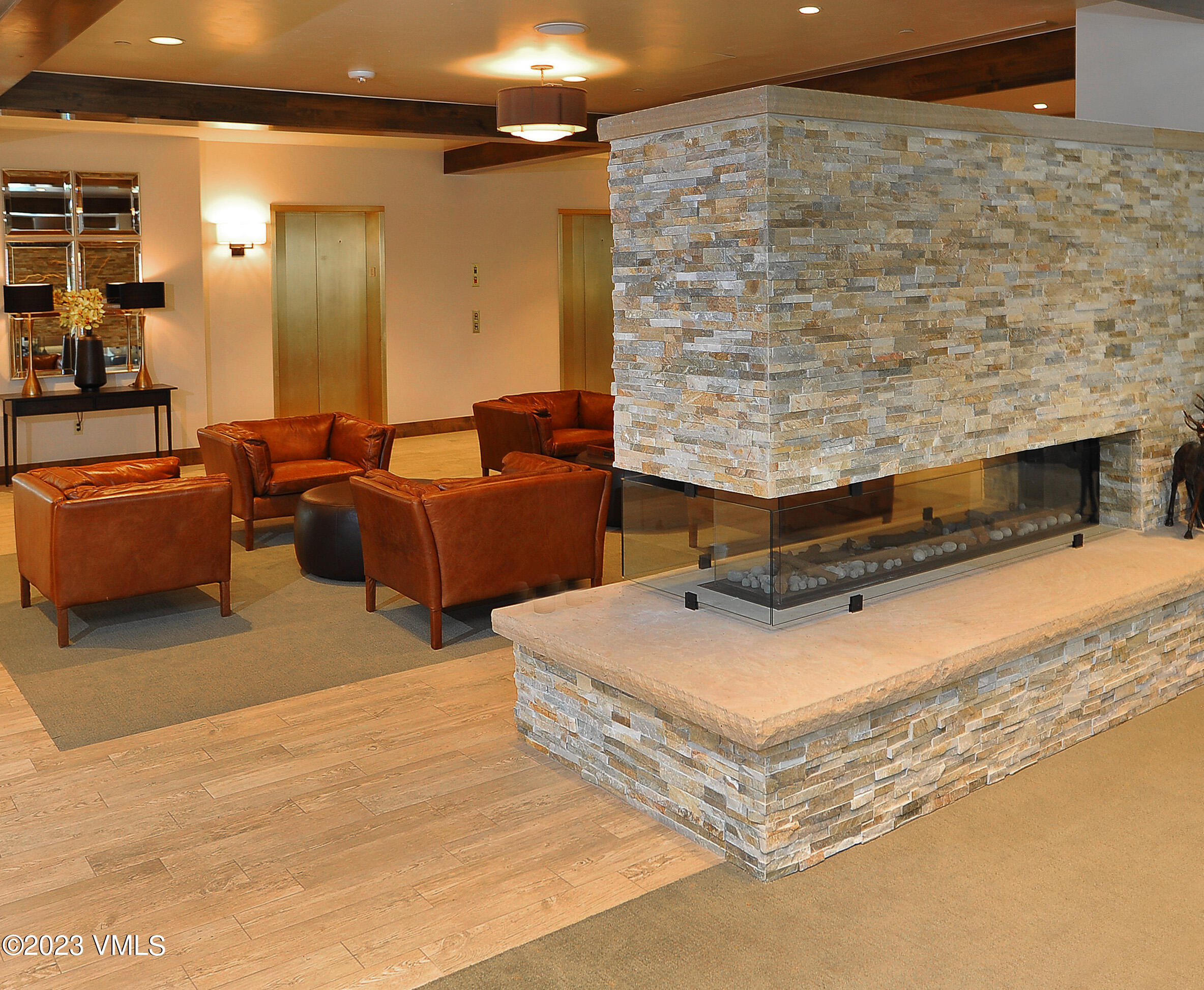 210 Offerson Road, Unit 109WEEK 11 Beaver Creek, CO 81620 - Photo 22 of 25 a living room with couches and kitchen view