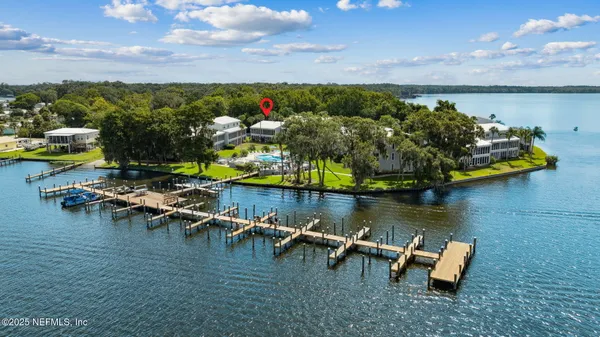 an aerial view of a house with outdoor space