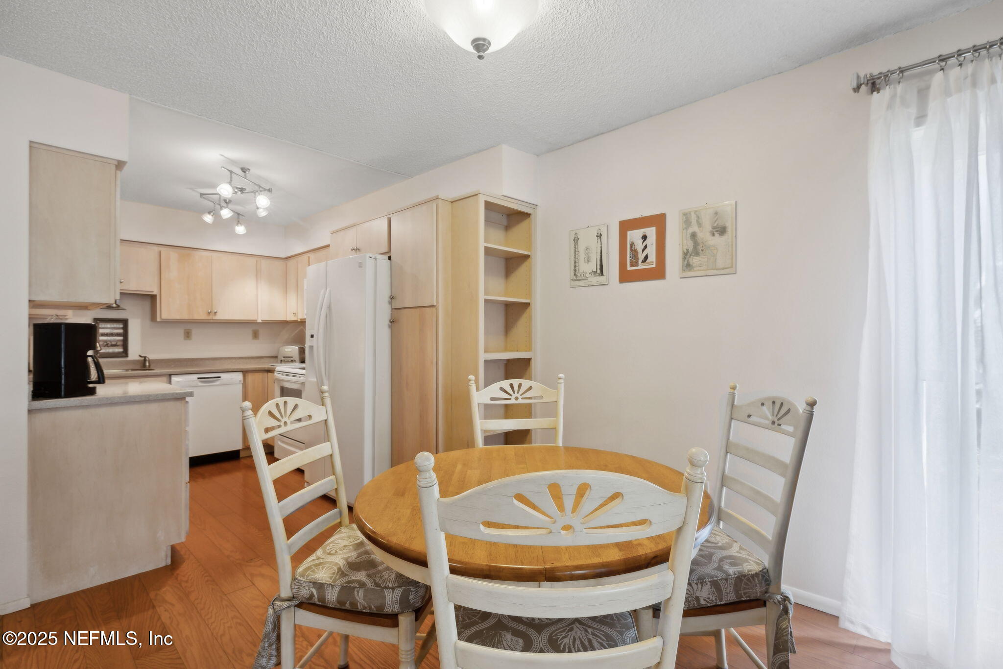 210 River Bend Court, Unit B Welaka, FL 32193 - Photo 11 of 41 a view of a dining room with furniture