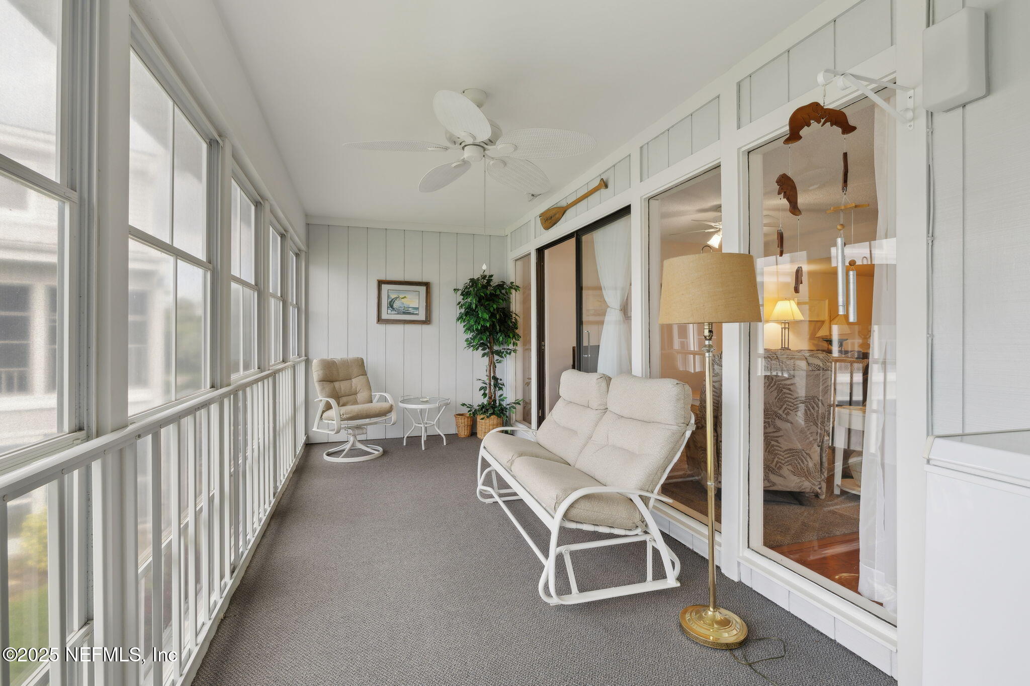 210 River Bend Court, Unit B Welaka, FL 32193 - Photo 20 of 41 a view of a livingroom with furniture and windows